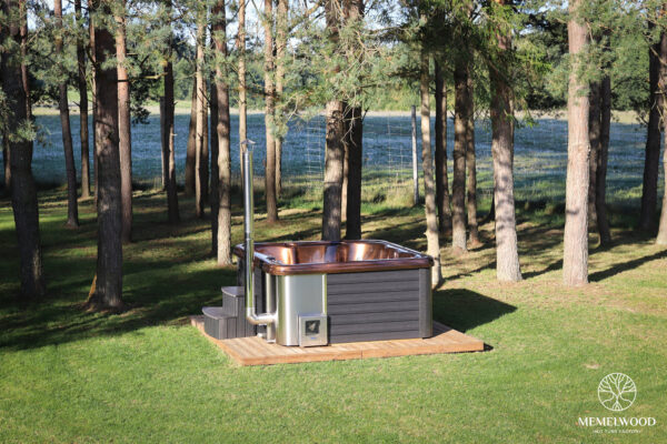 Jacuzzi hot tub with integrated wood fired heater and wpc cladding