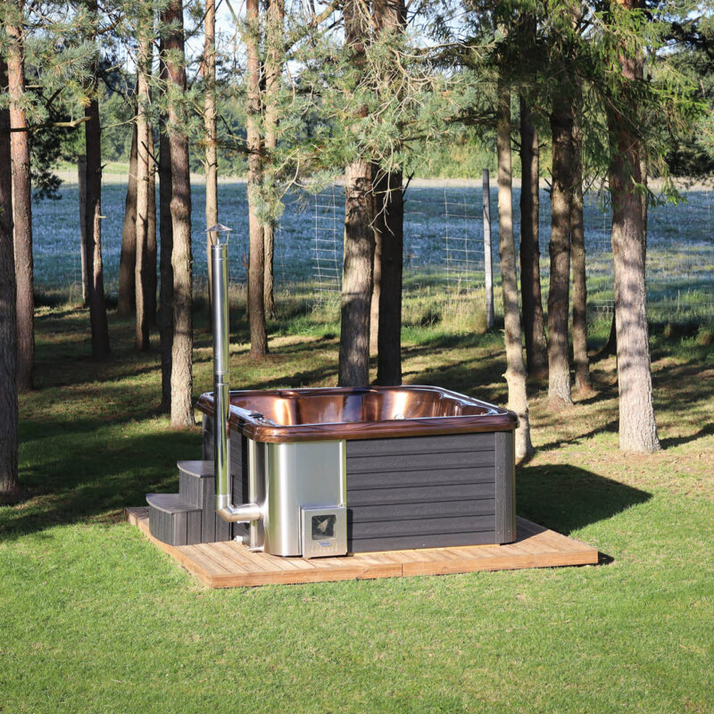 Jacuzzi hot tub with integrated wood fired heater and wpc cladding