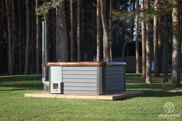 Jacuzzi hot tub with integrated wood fired heater and wpc cladding