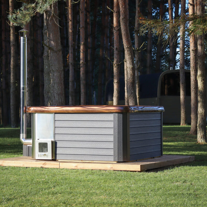 Jacuzzi hot tub with integrated wood fired heater and wpc cladding