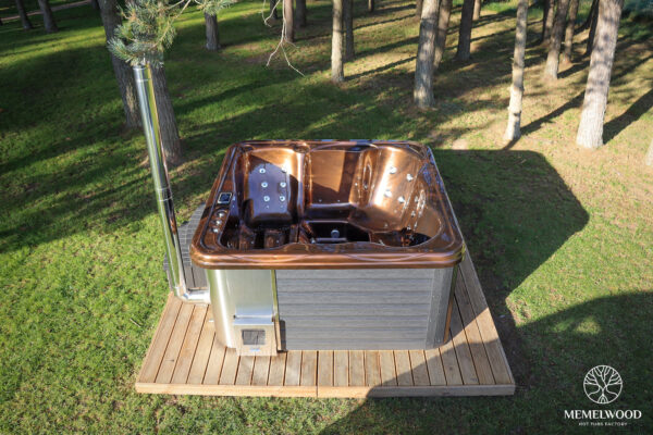 Jacuzzi hot tub with integrated wood fired heater and wpc cladding