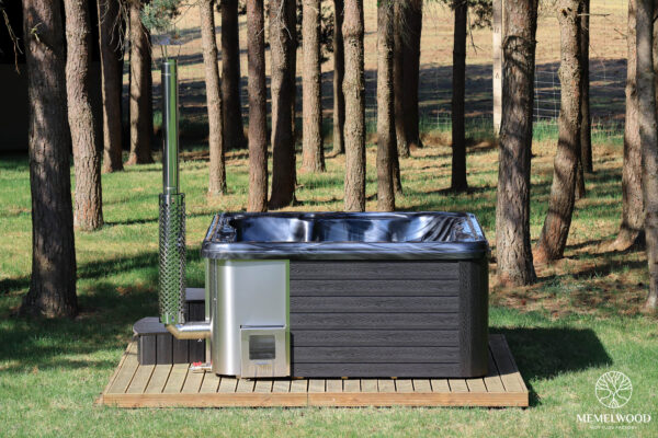 Jacuzzi hot tub with integrated wood fired heater and wpc cladding