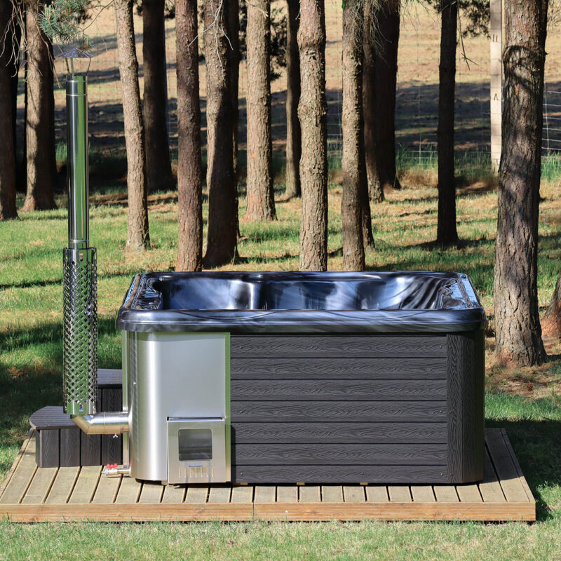 Jacuzzi hot tub with integrated wood fired heater and wpc cladding