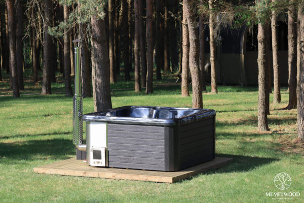 Jacuzzi hot tub with integrated wood fired heater and wpc cladding