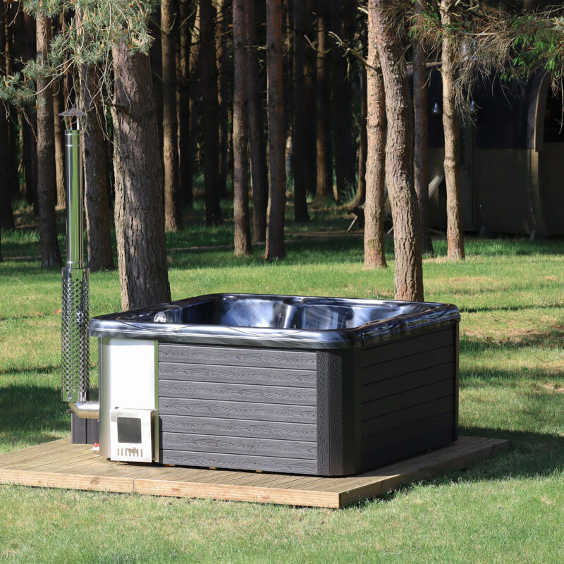 Jacuzzi hot tub with integrated wood fired heater and wpc cladding